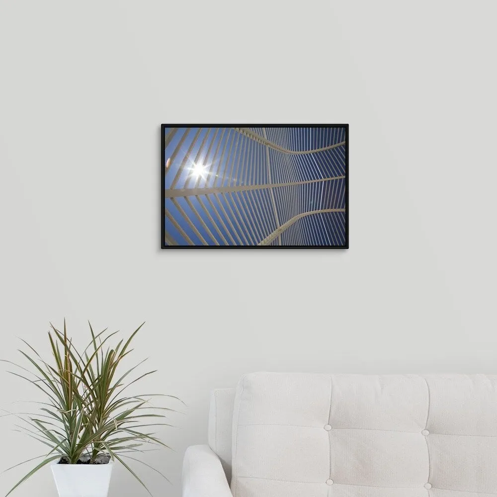 "A view from inside the arched walkway structure at the Athens Olympic Sports " Black Float Frame Canvas Art