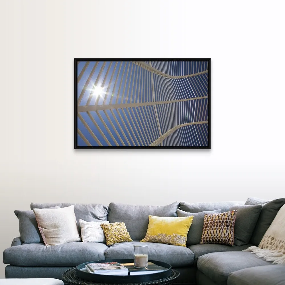 "A view from inside the arched walkway structure at the Athens Olympic Sports " Black Float Frame Canvas Art